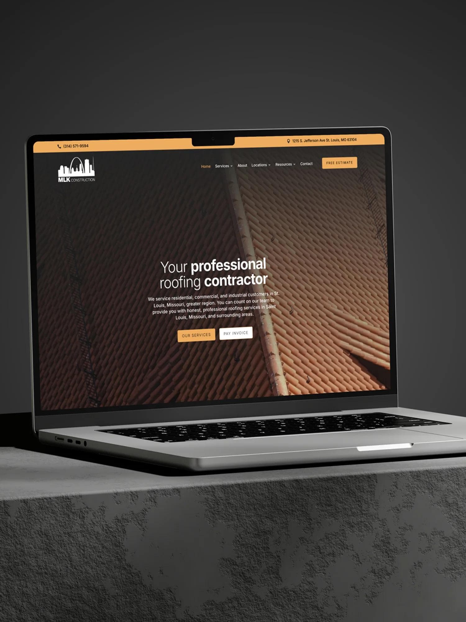 MLK Construction website on a laptop.